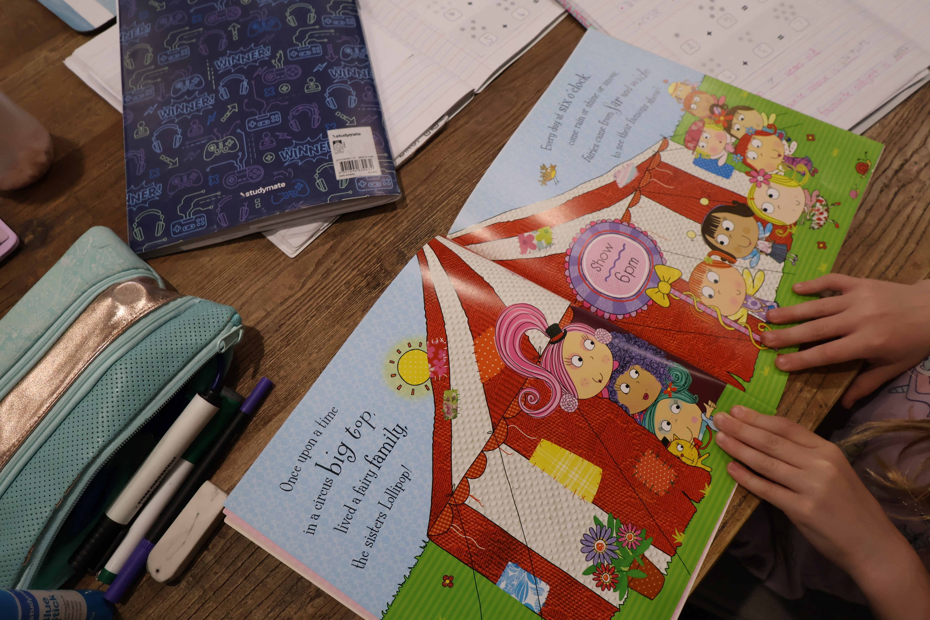 A child reading at the kitchen table